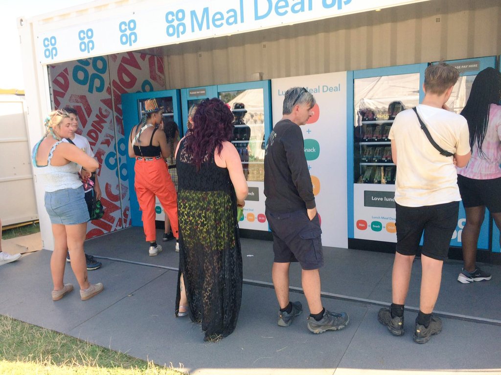 Customers queueing for Co-Op meal deal vending machine activation 