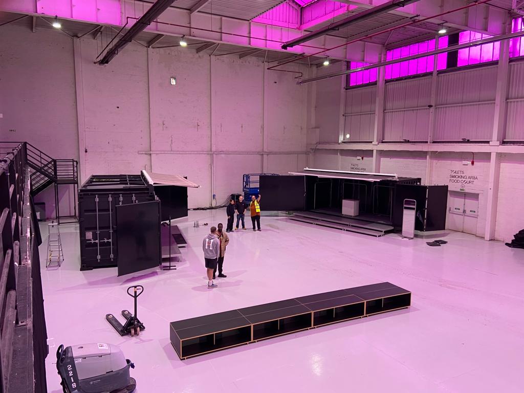 Represent Clothing shipping container conversion pop-up retail unit inside Manchester warehouse for exclusive member event