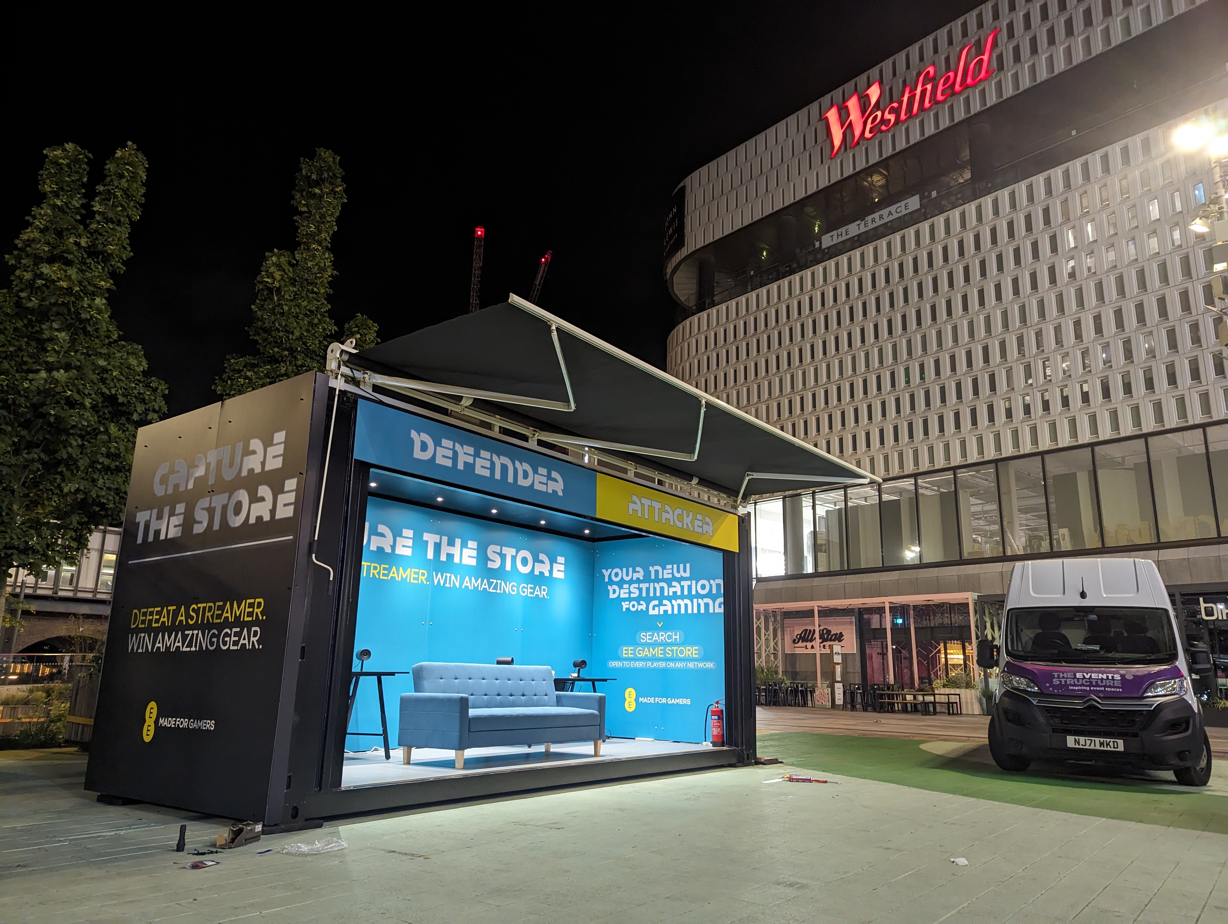 EE gaming PR campaign 'capture the store' housed in branded shipping container conversion experiential marketing activation, challenging contenders to go against top gamer to win prizes