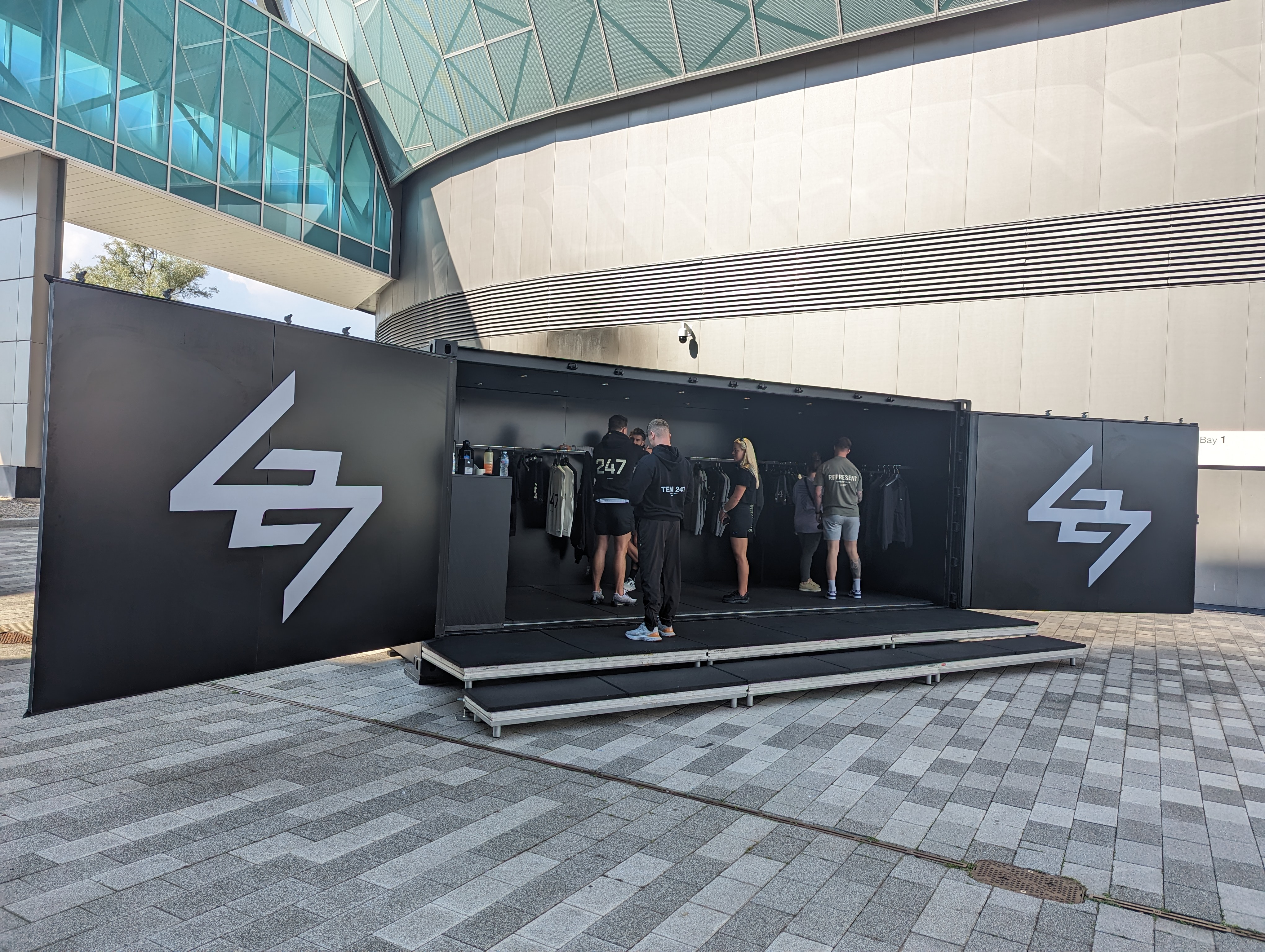 Represent Clothing pop-up shipping container conversion retail unit using The Event Structure Studio Premium customised container with open cargo doors for maximum impact on delivery
