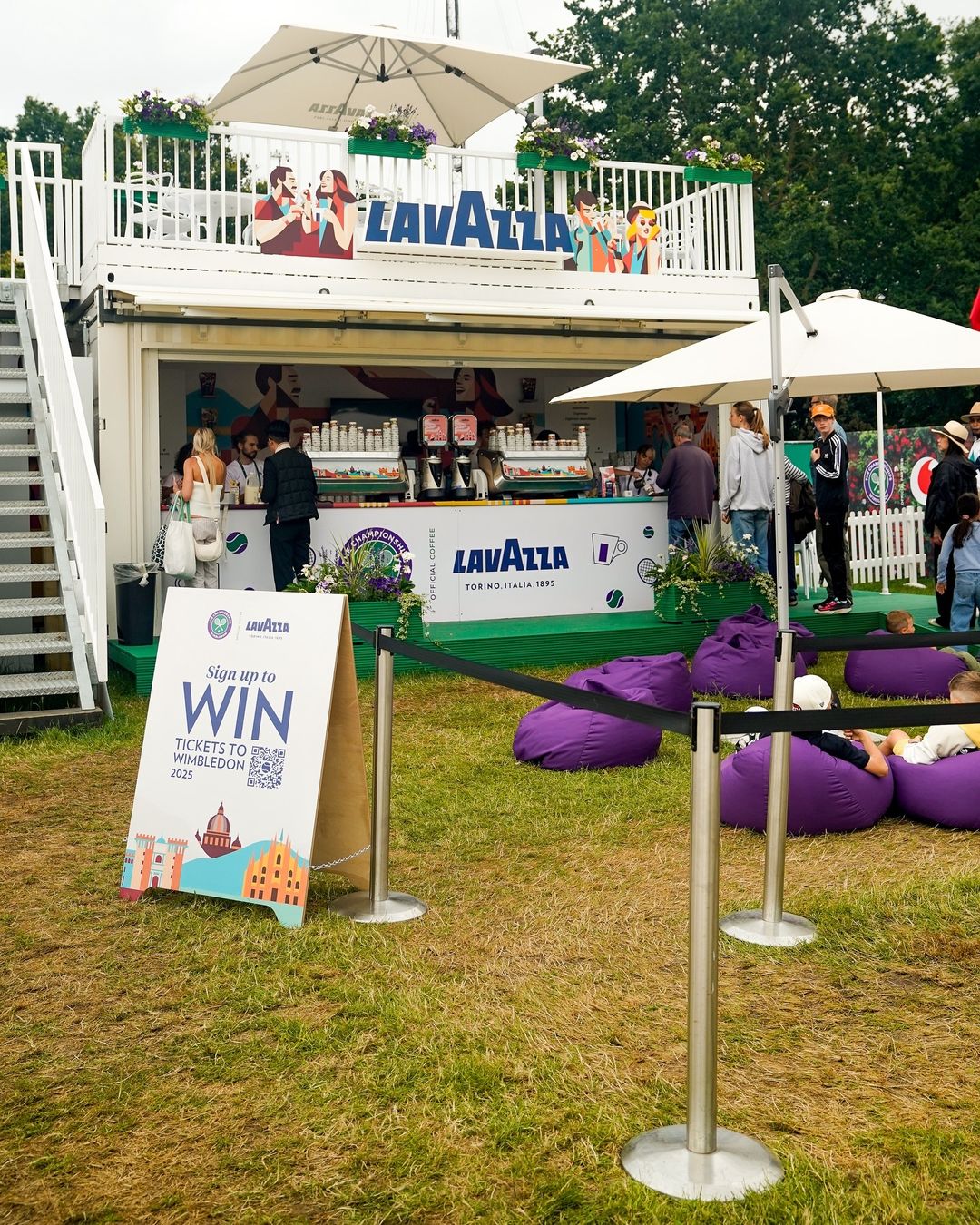 Lavazza shipping container coffee shop barista with upper deck seating area for Wimbledon the Queue