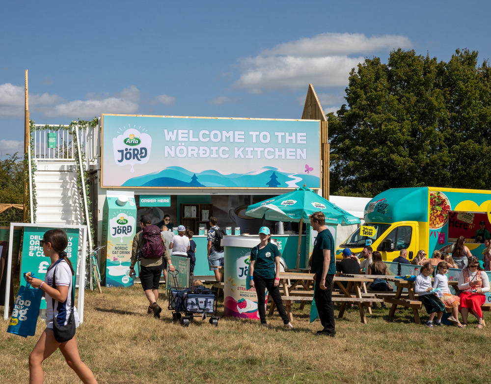 Arla Jörđ shipping container conversion activation for product sampling campaign styled like a nord kitchen with upper deck terrace for customer viewing