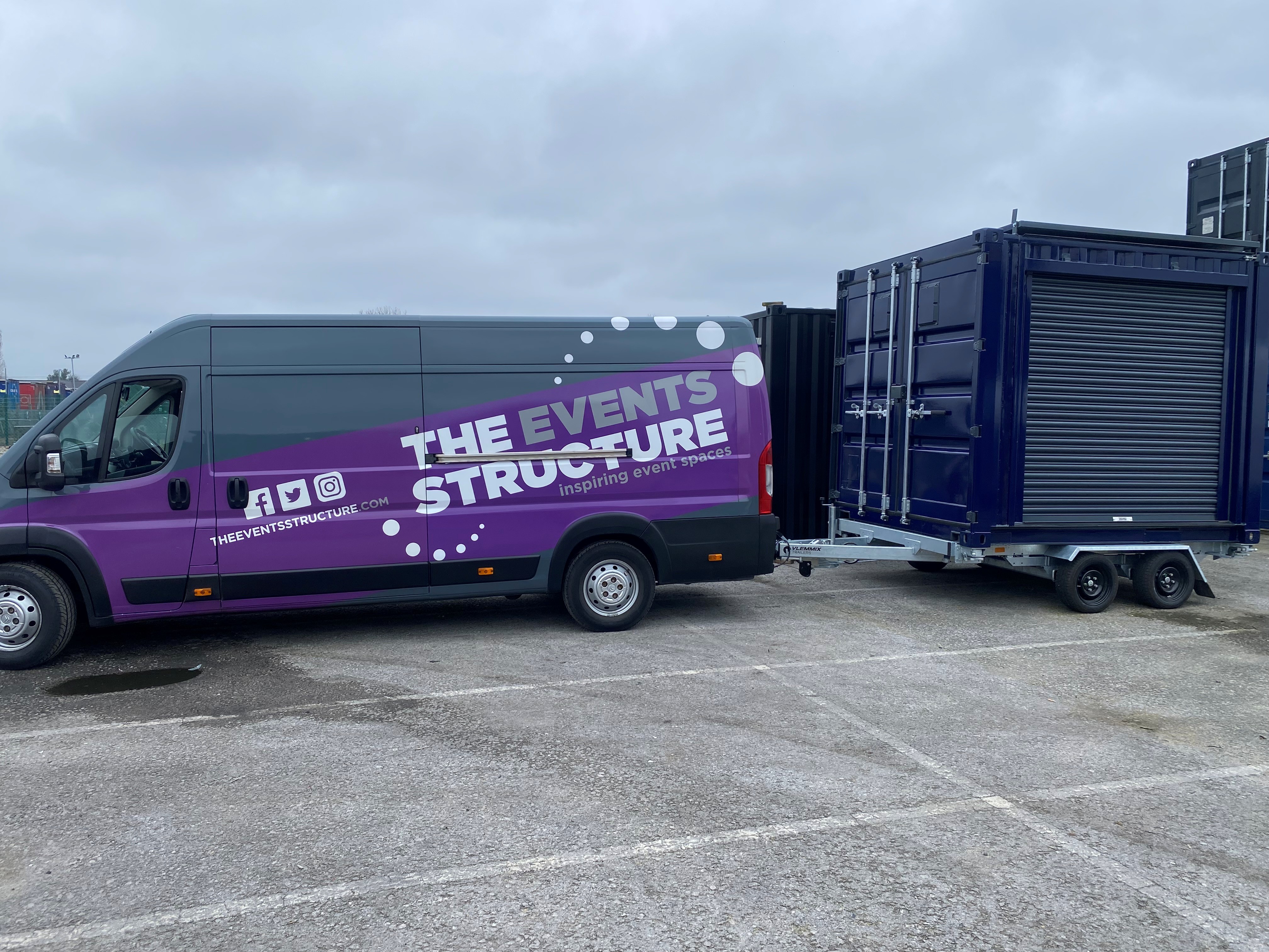 Van towing the 10ft Boutique shipping container on a trailer, demonstrating easy transport and installation for brand activations.
