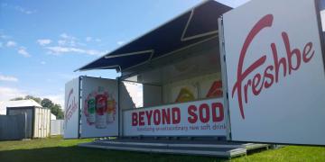 Shipping container bar Outlet for Freshbe soda at outdoor festival