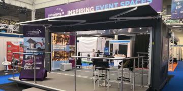 Shipping container conversion showroom with The Events Structure branding at The Event Production Show