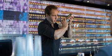 Shipping container pop-up bar serving cocktail drinks at a festival 