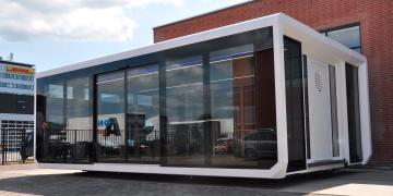 Expandable Panoramic mobile showroom exhibition unit with striking glass profile unbranded and on location 