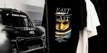 WheelPros in Germany exhibition with The Event Structure Gallery Plus shipping container activation with high-quality branding on new fabric tension print design system featuring clothing rack to sell branded merchandise 