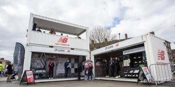 New Balance branded multi shipping container conversion activation at the London Marathon 2024 on popular Cutty Sark location