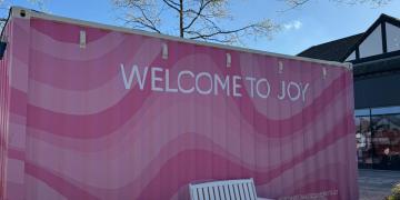 Gallery Plus shipping container conversion graphic wrapped in pink for Cheshire Oaks Designer Outlet pop-up weekend fashion event
