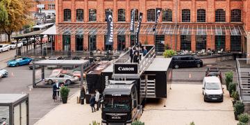 Branded Canon exhibition roadshow truck for B2B event marketing tour to showcase new products to potential business customers using Vanquish model