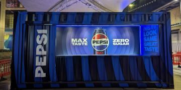 shipping container bar with LED lighting for night event and branded experience